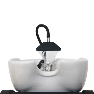 The Gamma & Bross Shower Blade, a luxury salon shower head accessory, elegantly installed on a shampoo station, delivering a smooth, waterfall-like stream that enhances the client’s washing experience with a premium spa-like touch.